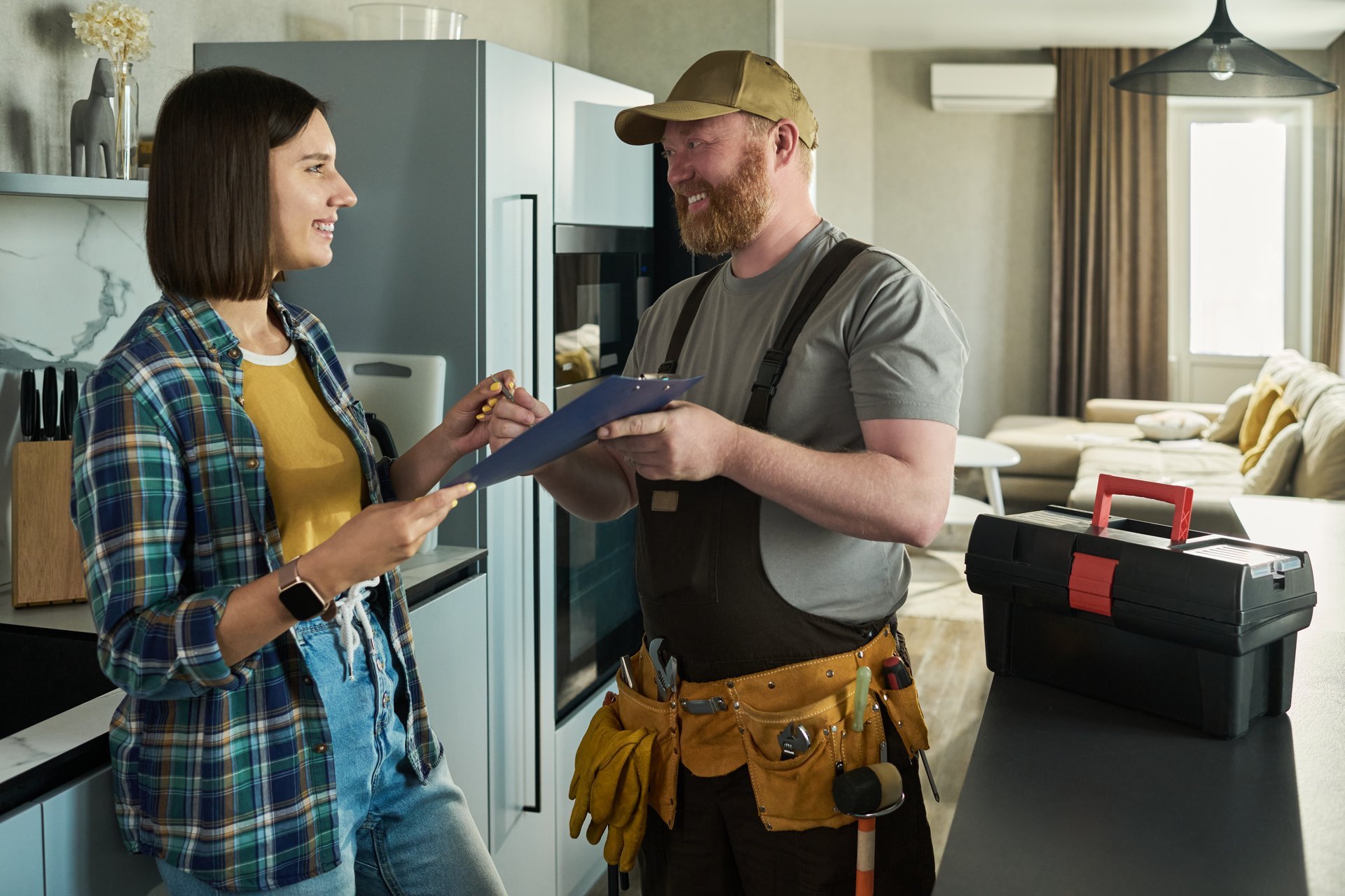 Homeowner reviewing service details with Sterling Peak technician