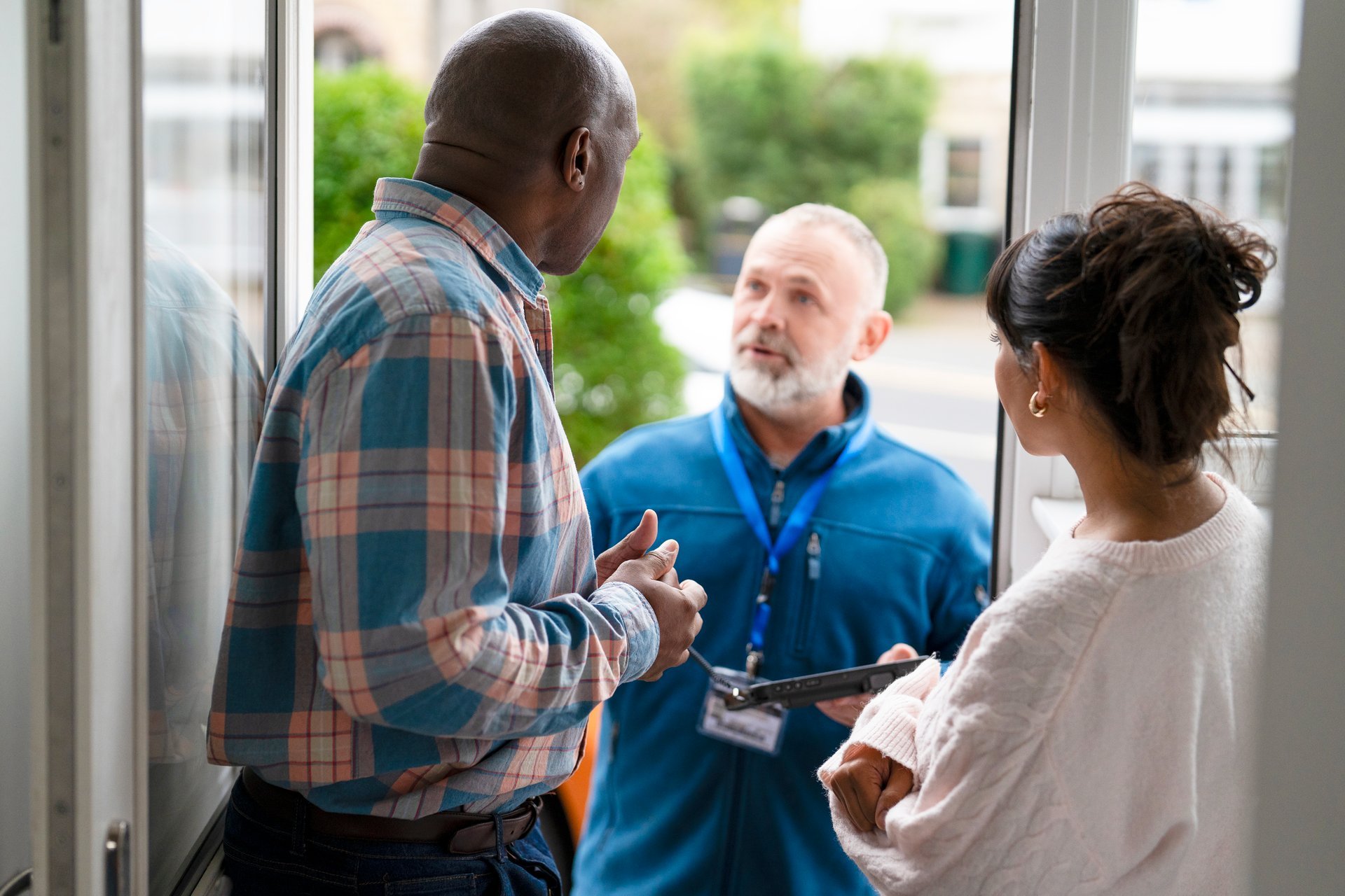 Sterling Peak service representative speaking with homeowners at their residence